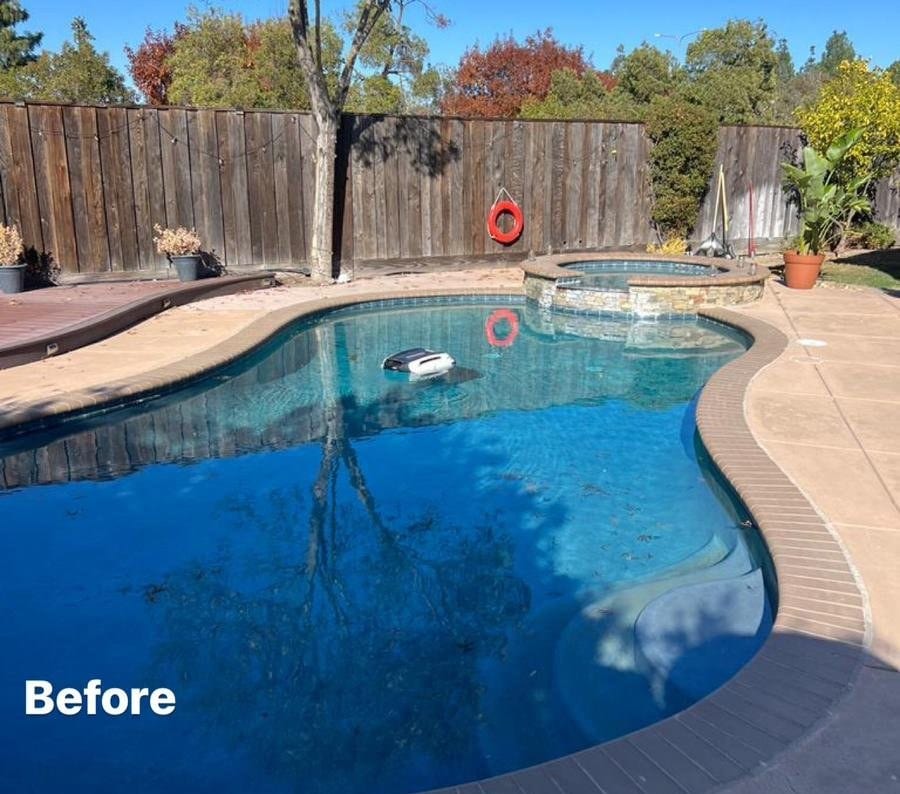 Backyard swimming pool with attached stone spa before demolition by Royal Demolition in the Bay Area